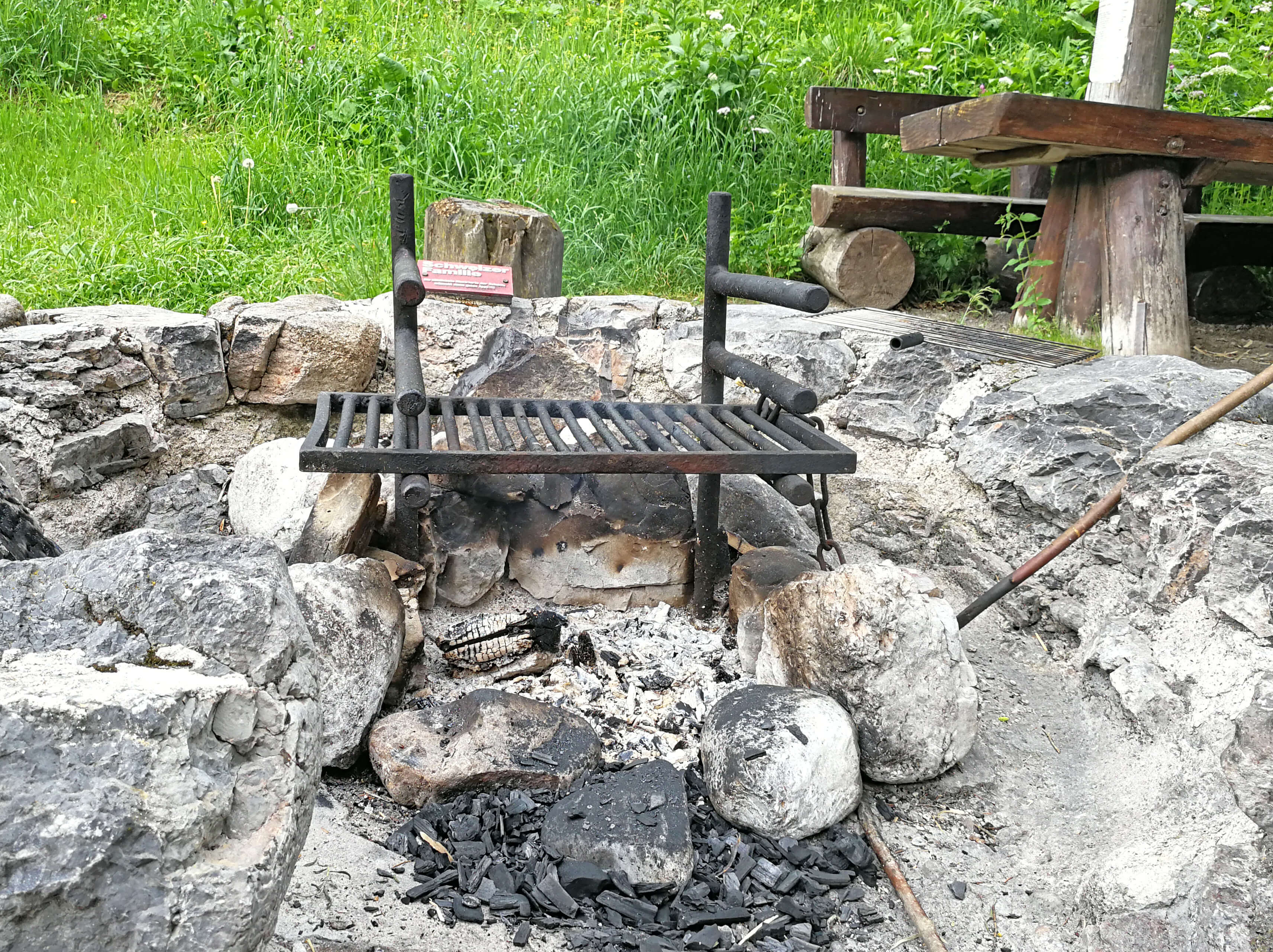 Barbecue grill surrounded by stone wall