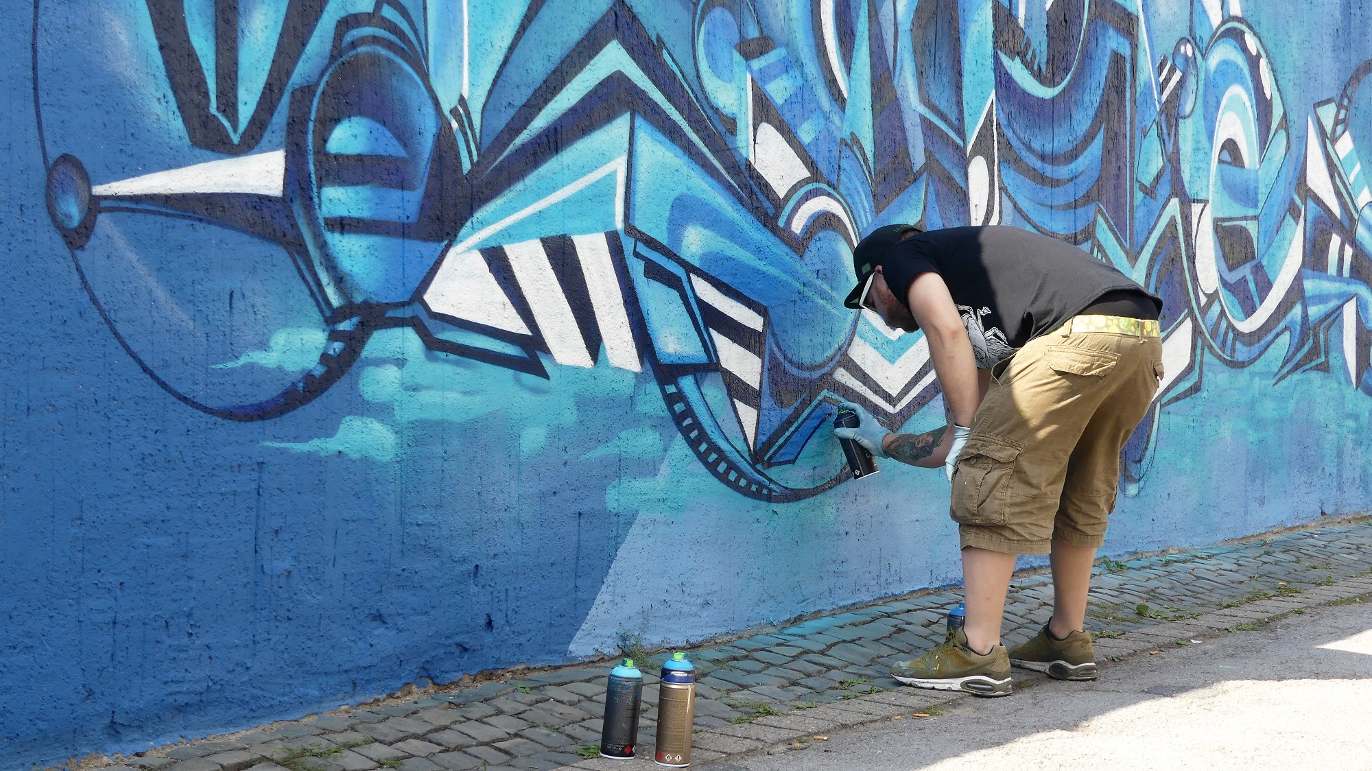 Graffitimaler an der Graffitimauer "Busdorfgalerie"