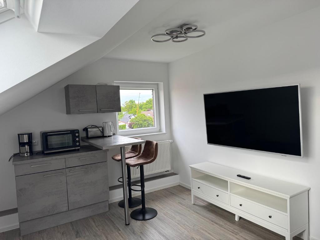 FeWo Weser-Pension - Studio links Sitzecke