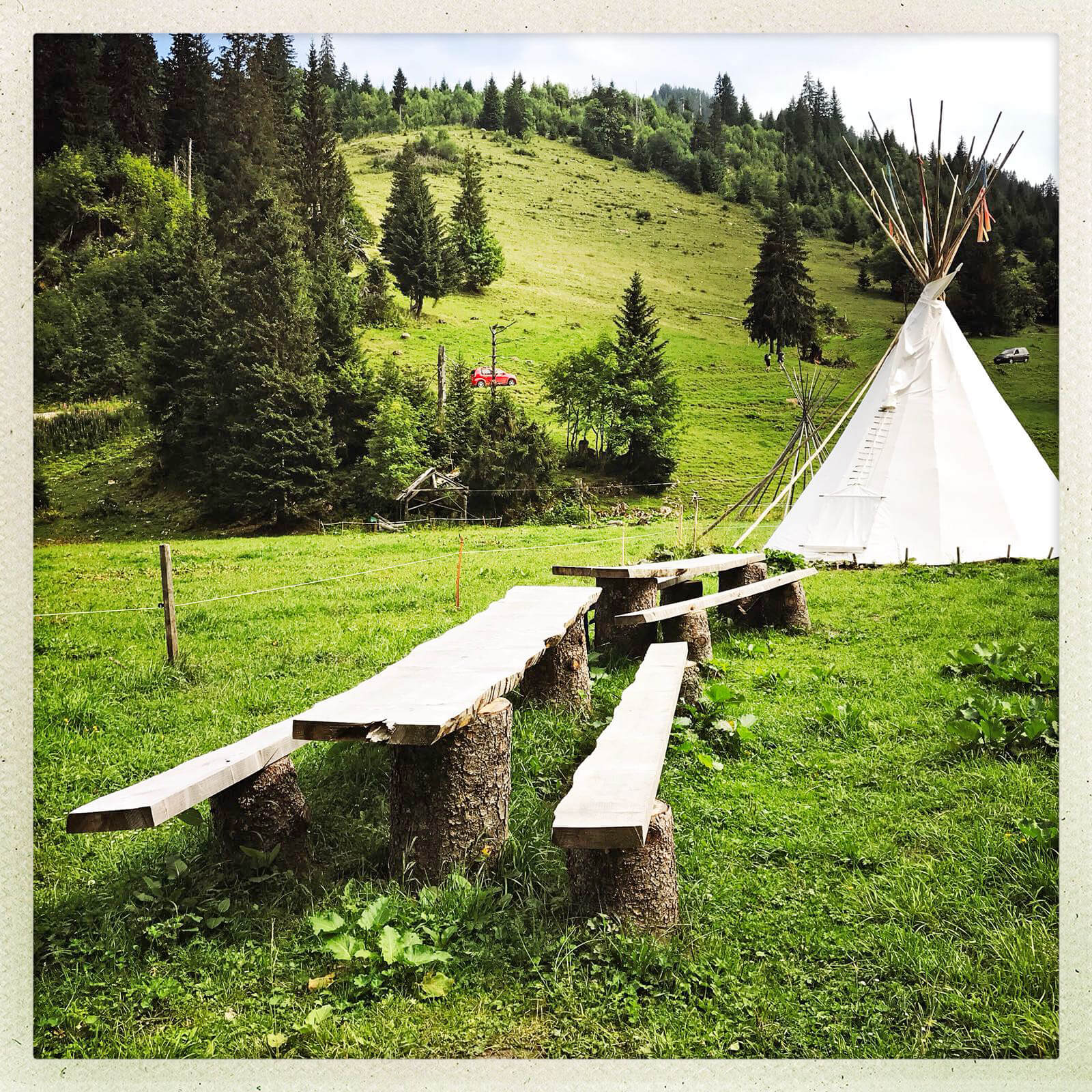 Tables and benches in the Tipi village